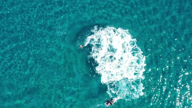 Fly boarding and sea riding in a sunny summer day, Zakynthos, Greece