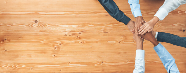 Top view panoramic banner hand stack by office worker show solidarity teamwork and trust in workplace. Diverse businesspeople unite for success with synergy and collaboration by hand stacking. Concord