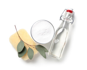 Bowl with baking soda, bottle of vinegar, cleaning sponge and eucalyptus branch on white background