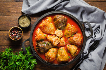 Cabbage Rolls with Ground Meat, Rice and Vegetables also known as Sarma, Golubtsy, Dolma on Rustic Wooden Background