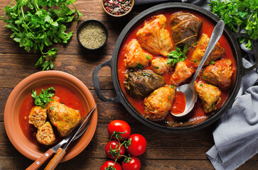 Cabbage Rolls with Ground Meat, Rice and Vegetables also known as Sarma, Golubtsy, Dolma on Rustic Wooden Background