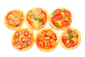 Different tasty mini pizzas on white background