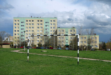 View of a children's soccer field and housing development of a housing estate with high-rise blocks...