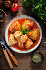 Cabbage Rolls with Ground Meat, Rice and Vegetables also known as Sarma, Golubtsy, Dolma on Rustic Wooden Background