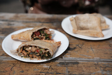 Fresh whole wheat chicken empanadas at a food market. Traditional Chilean savoury pastry.