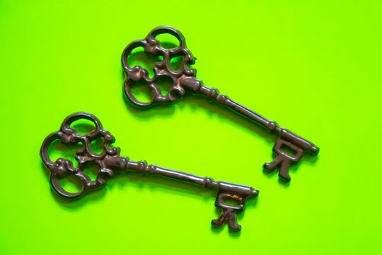 old keys on color background, close-up. Old ornate skeleton key 