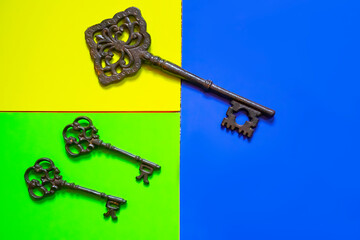 old keys on color background, close-up. Old ornate skeleton key 