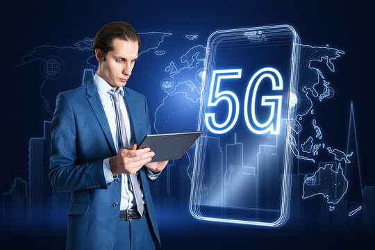 Attractive businessman using digital tablet with 5G and map hologram, polygonal connections on blurry blue background. Internet, speed and communication concept.