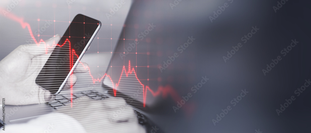 Aufkleber close up of male hands using laptop and cellphone with glowing downward business chart on blurry wid