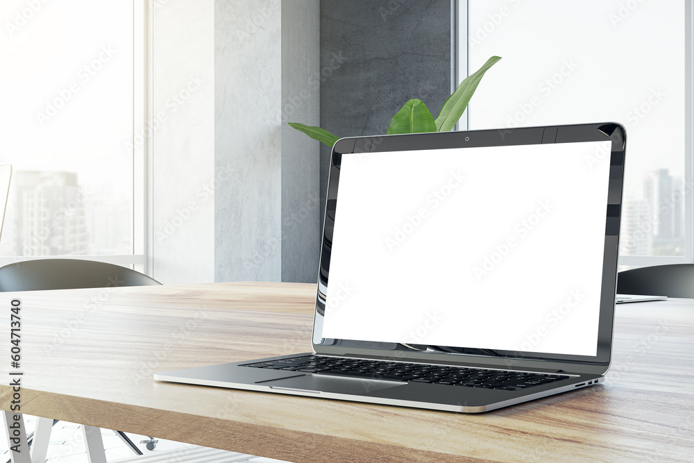 Poster closeup side view of a wooden office desk with white blank screen modern laptop, on city view window
