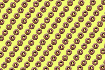 chocolate donuts on light yellow background small size