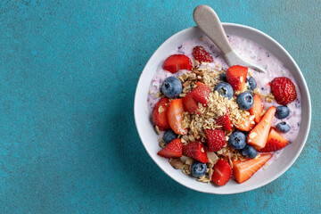 Muesli with fruits served in bowl