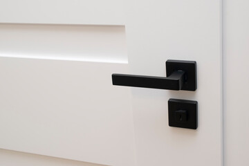 white door with black handle