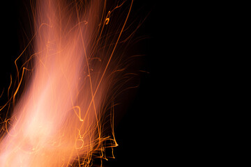 fire in dark. luminous lines of sparks. explosion black powder.