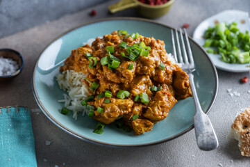 Chicken in curry sauce served in bowl