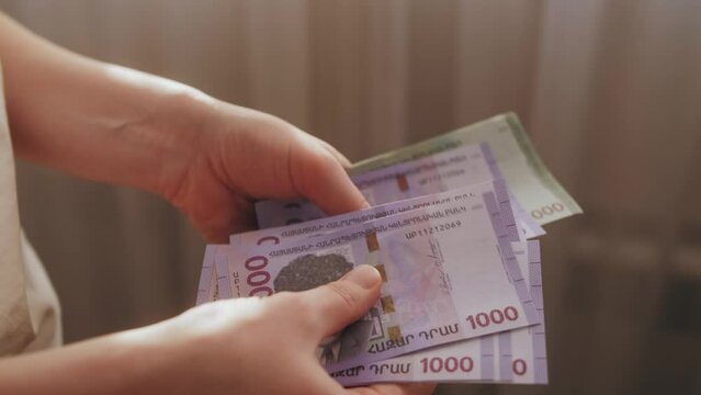 Man Counting Armenian Money Close up, Armenia dram amd banknotes, Tourist Exchgange Money in Bank of the Republic in Yerevan.