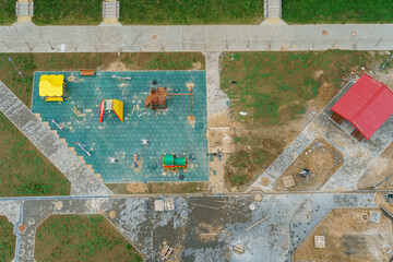 Playground and Parking near a residential multi-storey building. Top view of the courtyard. A large residential area with developed infrastructure.