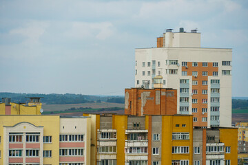 Dense urban development. A modern area of the city with beautiful multi-colored multi-storey buildings. Top view of the sleeping area of the city.