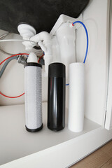 House water filtration system to drinkable condition, reverse osmosis. Filter cartridges of foamed...