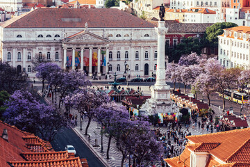 High perspective view of Rossio Square in Baixa district of Lisbon city, Portugal covered with...