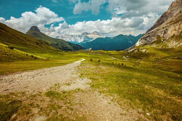 landscape with mountains, clouds and trail
