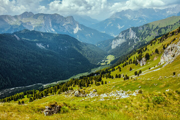 landscape with mountains, hills, clouds and trees