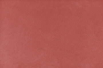 Texture background of red velours fabric textured like leather surface. Fabric texture close up of upholstery furniture textile material, design interior, wall decor, backdrop, wallpaper.
