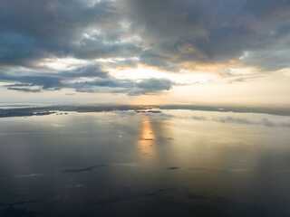 A tranquil sunrise illuminates the Pacific Ocean not far from Fak Fak, West Papua, Indonesia. This remote tropical area is home to extraordinary marine biodiversity.