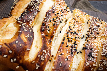 Turkish pastry filled with cheese, on old dark  wooden table background, close up macro