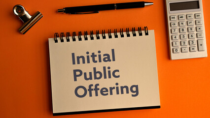 There is notebook with the word Initial Public Offering. It is an abbreviation for Initial Public Offering as eye-catching image.