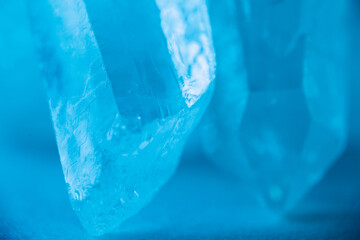  gemstone texture.Rock crystal macro texture.transparent quartz crystals background in blue...