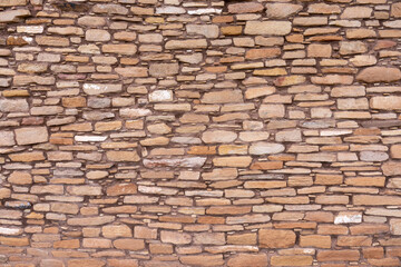 Stone pattern of a wall built by early Pueblos Indians with large cut stones set in mortar for the main structure and small ones to fill the gaps, Lowry Pueblo, Canyon of the Ancients NM, Colorado