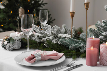 Beautiful table setting with Christmas decor indoors