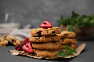 Cookies with freeze dried fruits and mint on grey table, closeup