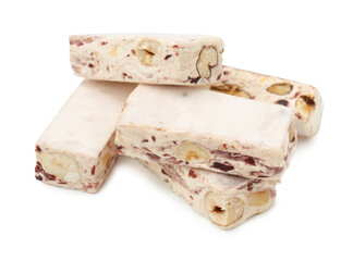 Many pieces of delicious nougat on white background