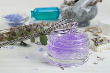 Obraz na płótnie Canvas Homemade lavender gel and whisk on white wooden table, closeup