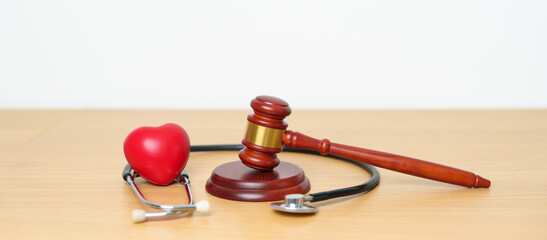 Gavel and stethoscope on table. Medical and Health Law, legal of medical malpractice concept