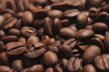Brown Roasted Coffee Beans Closeup On Dark Background