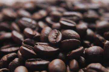 Brown Roasted Coffee Beans Closeup On Dark Background