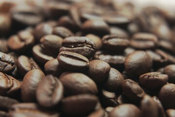 Brown Roasted Coffee Beans Closeup On Dark Background