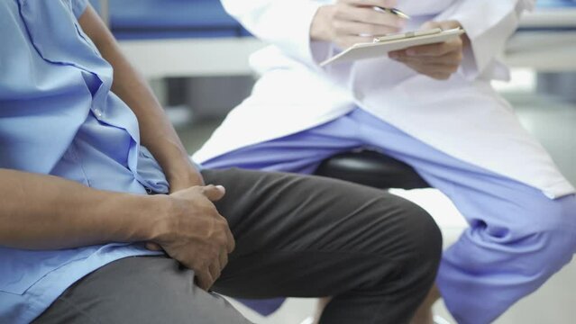Man with prostate enlargement having examination and consulting a doctor The doctor will ask about the patient's illness and give health advice. 4k video