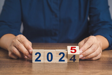 Flipping of 2024 to 2025 on wooden cubes for preparation of new year change