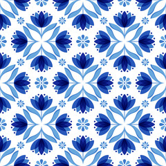 Fototapeta na wymiar Seamless pattern with blue floral motifs. Repeatable pattern tile inspired by Mediterranean tile.