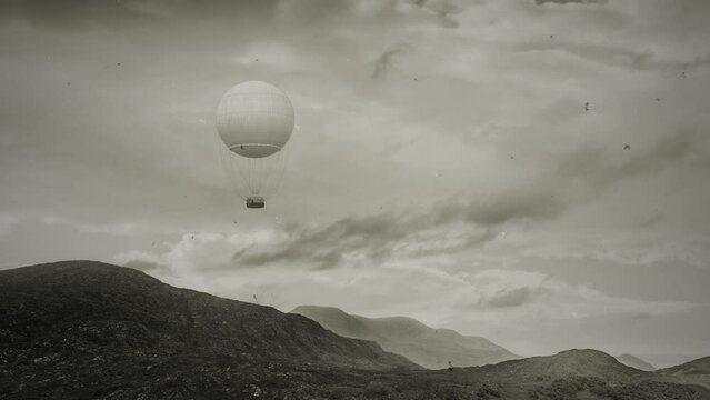 Air Balloon flying above a mountain landscape - retro vintage flickering dusty 4k footage
