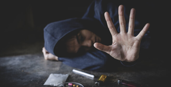 Stop drugs concept. A woman making a stop gesture to drugs, Human hands stop drugs . International Day against Drug Abuse.