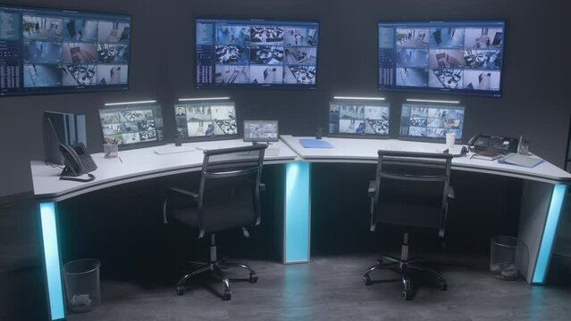 Workspace in security monitoring center for watching CCTV cameras with AI face scanning system. Computer monitors, tablet and big digital screens showing surveillance cameras video footage. Timelapse.