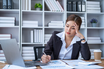 Tired Young Asian businesswoman with headache Serius stressed concern nervous tired in office, business office lady employee feeling bad sick unwell 