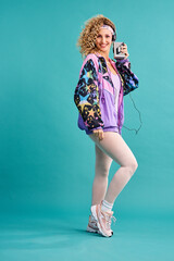 80s fitness, retro and woman portrait with vintage, neon and style in a studio. Blue background,...