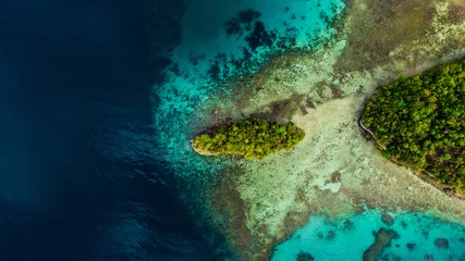 Fotobehang Slaapkamer Drone, island and water for travel, adventure and exploring nature from above. Empty, paradise and top view of tropical nature, beauty and scenery in Indonesia for traveling, tourism and vacation  © Armand Burger/peopleimages.com