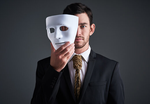 Two faces, holding mask and businessman portrait in a studio with serious face with secret and fraud. Worker or corporate criminal with rope tie showing identity theft or liar in business suit mockup